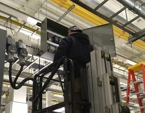 Technician-on-platform_908x1210-e1518632581892.jpg